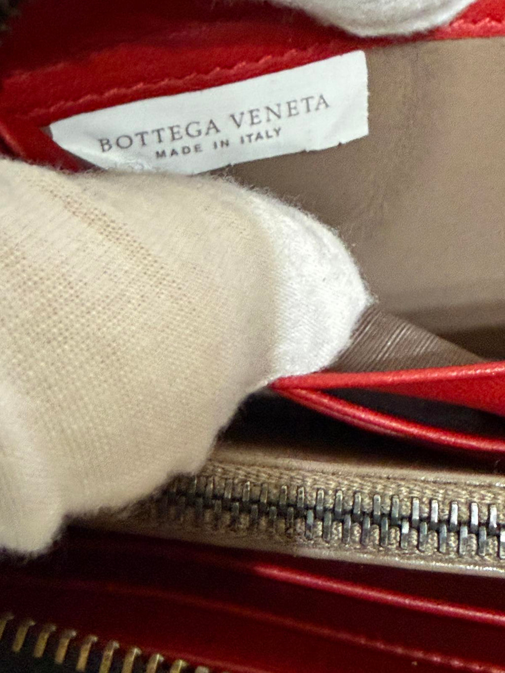 Bottega Veneta Intrecciato woven leather zip-around long wallet in black.