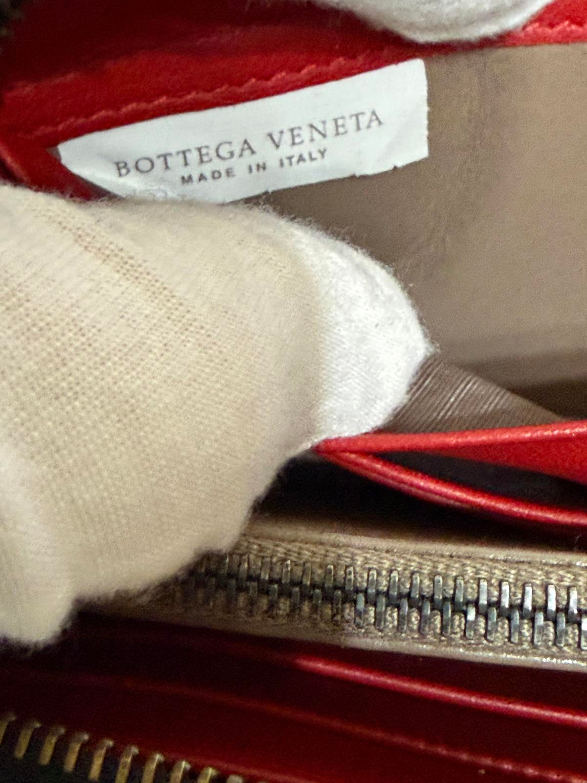 Bottega Veneta Intrecciato woven leather zip-around long wallet in black.