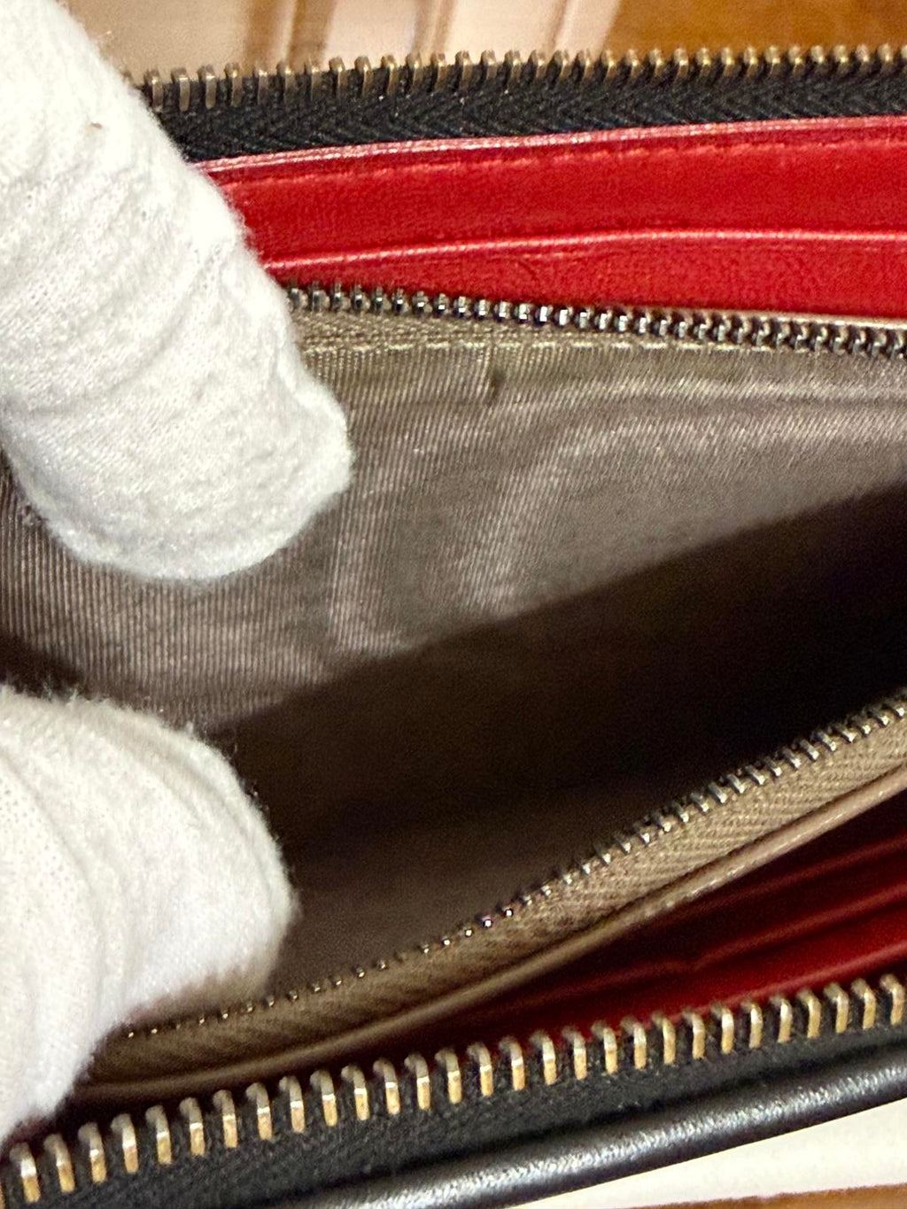 Bottega Veneta Intrecciato woven leather zip-around long wallet in black.