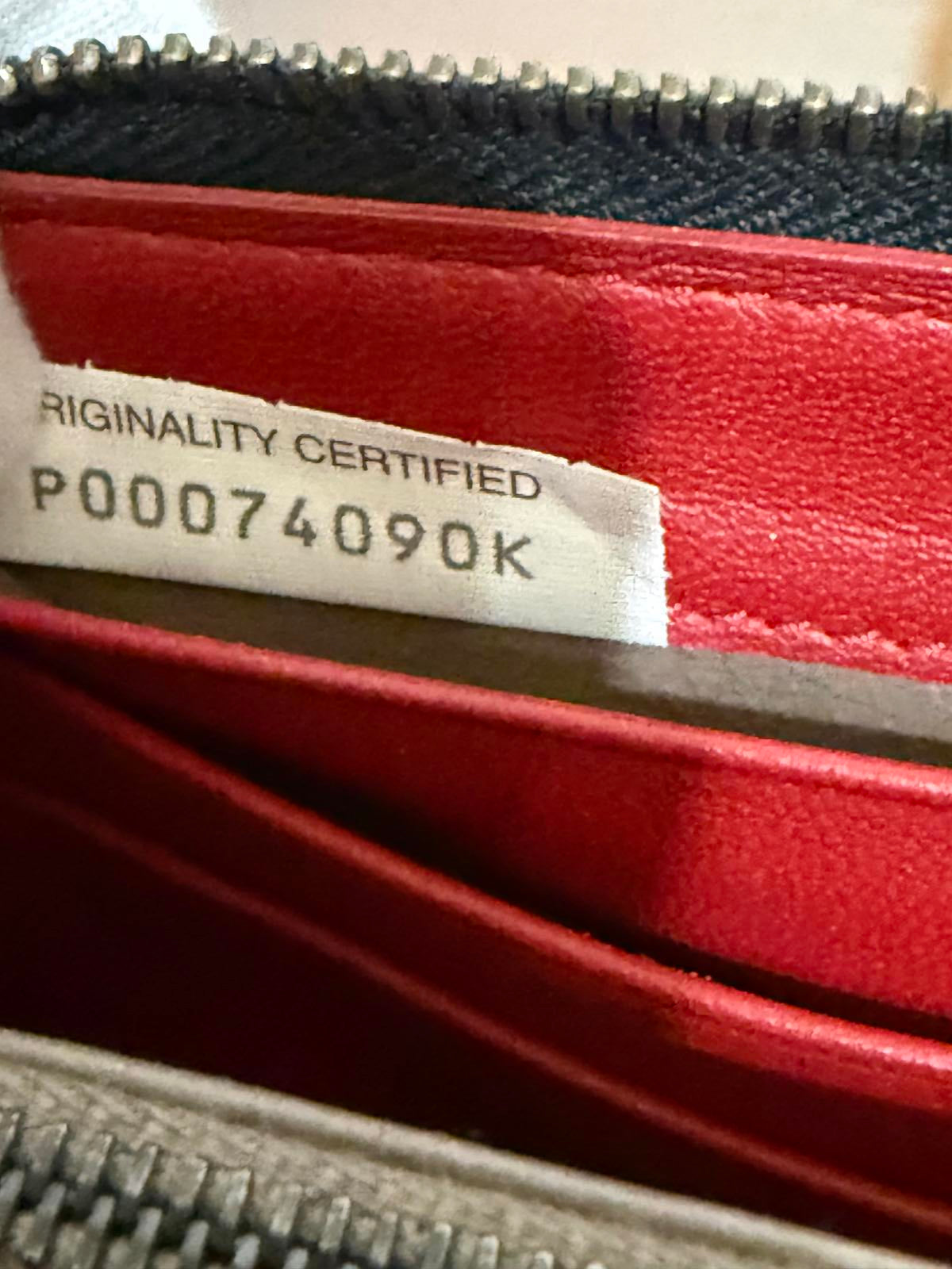 Bottega Veneta Intrecciato woven leather zip-around long wallet in black.