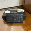 CHANEL Black Lambskin Camellia Embossed Long Bifold Wallet